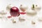 Art composition with fresh garlic and red and white onions on white