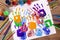 Art and craft class, hand prints, painting supplies, school desk