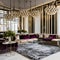 Art Deco Lounge: An opulent art deco lounge with geometric patterns, mirrored surfaces, and a luxurious velvet sectional sofa fo