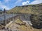 Art deco streetlamps line the top of the concrete wall of the Owyhee Dam in Oregon, USA