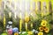 Art easter background with fence, eggs, spring flowers