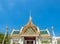 Art at facade and entrance door in The Temple of Emerald Buddha, the most beautiful landmark in Bangkok, Thailand