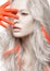 Art fashion girl with white skin in form of albinos, red arms and lock hair. Creative beauty image .