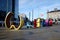 Art installation of giant coloured letters spelling Watford on the forecourt of Watford Junction Station