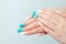 Art manicure. Trendy nail polish. Beautiful stylish woman hands with green white gradient pink pastel colors manicure with crystal