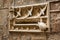 Art nouveau style stone mailbox decorated with swallows and turtle figurines on the wall of Casa de l\'Ardiaca