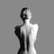 Art Nude fashion Nude back of blonde woman on grey background. G