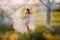 art photo fantasy woman angel with golden bird wings walking in forest fairy mystical girl greek goddess long white