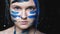 Art portrait confident woman blue warrior makeup