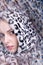 Art portrait, kaleidoscope. Woman in leopard hoodie