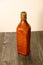 art sculpture leather bottle with rope around top mouthpiece