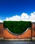 Art shrubs and brick fence background