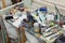 Art studio atelier table full of used artistic oil paint tube brush equipment workshop