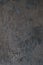 Art stylized decorative dark gray cement plaster wall as background texture