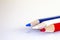 Art tools education Red White and Blue Colored Pencils on white background