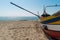 Arte Xavega typical portuguese old fishing boat on the beach in