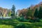 Artesian fountain in an autumn landscape in Roman Park, Romania