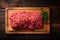 Artful composition top view of uncooked minced beef on wood