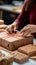 Artful packaging: Close-up showcases confectioner\\\'s hands expertly wrapping cardboard box with precision.