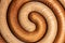Artfully spiral shaped pot coasters made of wood