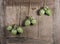 Artichokes on aged wooden background