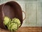 Artichokes spilling out of a basket