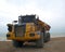 Articulated dump truck. The 29 ton Bell B40D on pebbled beach.