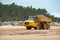 Articulated Dumper Truck transporting sand on Wells beach.