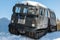 Articulated military tracked cargo vehicle on snow
