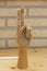 Articulated wooden hand with two raised fingers