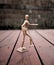 Articulating Artist Wood Mannequin on Wooden Deck