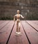 Articulating Wood Drawing Mannequin on Wooden Deck