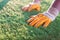 Artifcial grass and worker hands