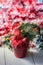 Artifical poinsettia - christmas symbol in red flower pot.