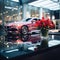 Artificial blooms adorn a glass table in a sleek car showroom.