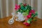 Artificial bougainvillea flowers in decorative pot in the form of a bicycle
