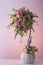 Artificial bouquet of diffirent beautiful small flowers with nice silver chain and two hanging hearts. Flower pot