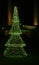 Artificial Christmas tree made of green electric lights.