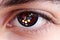 Artificial close-up Eye Cyborg face of mechanical robot, future with red glow