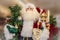 Artificial decor Santa Claus figure holding a tree and a nutcracker and a list of good boys and girls against blurred background