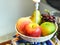 Artificial fruit in white basket for decoration, apple, peach, p