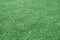 Artificial grass football field loan with blur effect in green tone