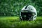 Artificial grass forms background for minimalist American football helmet