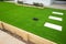 Artificial grass/lawn turf in the front yard of a modern home/residential house.