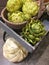 Artificial green flowers and pumpkin