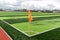 Artificial green grass on professional soccer field. An outdoor artificial football field awaiting the players` exit. Inscription