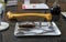 Artificial human femur and surgical tools set on laboratory worktop