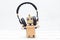 Artificial Intelligence. Robot in golden headphones on a light b