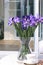 Artificial iris flowers in a glass vase