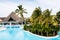 Artificial island and cafe-bar in the middle of a pool with chairs in the water